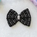 Détail du nœud en tweed noir et blanc pour animaux avec perles et strass étincelants - Taille unique / Noir