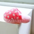 Detailed side view of soft pink plush home slippers with white polka dot pattern for winter - Pink Polka Dot Slipper