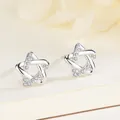 Elegant 925 sterling silver star stud earrings featuring sparkling cubic zirconia stones - White Gold