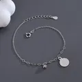 S925 sterling silver beaded bracelet featuring round coin and bell charms with lobster clasp - 925 Silver / White Gold