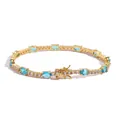 Golden tennis bracelet featuring oval blue gemstones and shimmering zircon accents - 18cm / Gold Blue Zircon