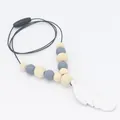 Detail view of silicone feather teether necklace with grey beads and wooden safety clasp - Light Gray (Marble Pattern)