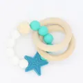 Detail of baby teething toy with silicone beads, wooden rings and blue star pendant - Blue