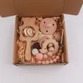 Five-piece baby beech wood bear rattle and pink silicone pacifier gift set in a box - Hedgehog Style