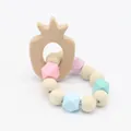 Close-up of pineapple wooden teether and macaron colored silicone bead bracelet for babies - Pineapple