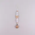 Natural beech wood pacifier clip with white silicone beads and a cute bear head motif - White