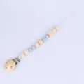 Baby pacifier clip with grey silicone beads and natural wood beads on white background - Gray