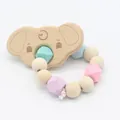 Baby teething bracelet with wooden elephant charm and macaron silicone beads on white base - Elephant