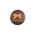 Circular wooden pendant with engraved bow and handmade text for DIY jewelry making - Bow Style / Dark Coffee