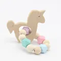 Detail of wooden unicorn teether with pastel silicone beads for infant soothing - Unicorn