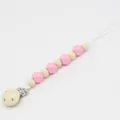 Attache-tétine en silicone rose et perles de bois naturel avec clip en métal - Rose