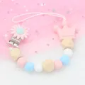 Silicone pacifier clip with macaron beads, wooden beads and pink crown charm - Pink