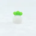 White pineapple silicone teether toy for baby with green leaves on white plush background - White
