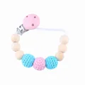 Sujeta chupetes artesanal con cuentas de madera y bolas de ganchillo rosa y azul - Rosa