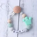 Silicone pacifier clip with wood beads mint crown and crochet ball for baby - Green