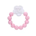 Macro detail of food-grade pink silicone teething beads with white rose flower accent - Pink