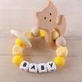 Detail of baby teething bracelet with wooden cat charm and yellow silicone beads - Fox