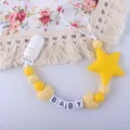 Detail of baby pacifier clip with yellow silicone beads, star pendant and baby letter beads - Yellow
