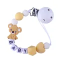 Sujetachupetes de silicona con koala marrón y cuentas de letras BABY en fondo blanco - Amarillo