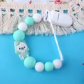 Silicone pacifier clip with mint green beads and a cute cartoon polar bear detail - Green