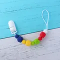 Close-up of rainbow silicone beads and white plastic clip on baby pacifier chain - Royal Blue Style