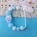 Sujetachupetes de silicona azul y blanco con decoración de oso y clip de agarre plástico - Azul