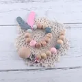 Schnullerkette aus Buchenholz und Silikon mit Beißring und Glöckchen für Babys - Rosa Schmuckset