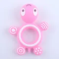 Pink turtle silicone baby teether with textured surfaces and ring grip for gum relief - Pink