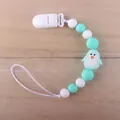 Detail of silicone baby pacifier clip with mint green beads and cute penguin pendant - Penguin Green