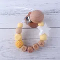 Chupetero de silicona con cuentas amarillas, estrellas de madera y letras BABY - Amarillo