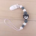 Macro detail of silicone pacifier clip featuring grey elephant bead and white beads - Elephant Dark Gray
