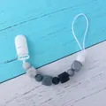 Silicone pacifier clip with black and marble beads for baby teething and security - Grey Style