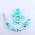 Detail van siliconen bijtringenset schildpad met fopspeenketting en BABY kralen - Meerblauw