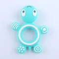 Macro view of blue silicone turtle teether with various massage textures for baby gum relief - Lake Blue