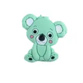 Macro detail of mint green silicone koala teething bead with soft cartoon features - Green