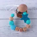 Sujeta chupetes de silicona con cuentas de madera y letras Baby en azul y turquesa - Azul lago