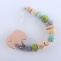 Detail of wooden elephant clip and silicone beads on infant pacifier tether strap - Elephant Style