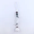 Detail of silicone pacifier clip with grey beads, metal bells and sturdy buckle - Gradient Grey