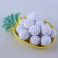 Macro shot of 16mm white crocheted cotton yarn balls for DIY jewelry accessories - White