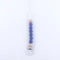 Detail of baby pacifier clip with blue silicone beads and natural wooden accents - Sapphire Blue