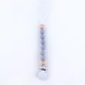 Detail of baby pacifier clip with grey silicone beads and natural wooden accents - Light Gray