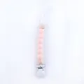Detailed view of silicone beads and wooden ball on baby pacifier clip chain - Light Pink