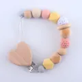 Silicone pacifier clip with beech wood heart clamp and pastel crochet beads - Heart Style