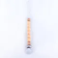Detail view of baby pacifier clip with natural wood beads and soft silicone beads - Nude