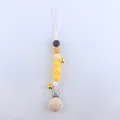 Yellow silicone pacifier clip with colorful beads, metal bells and a wooden clip - Yellow