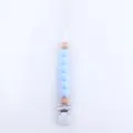 Close-up of light blue silicone beads and natural wooden beads on a baby pacifier clip - Sky Blue