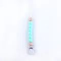 Detail of baby pacifier clip with light blue silicone beads and natural wooden accents - Mint Green