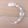 Baby silicone pacifier clip with grey beads and a cute elephant charm on wood background - Elephant Light Gray
