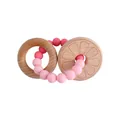 Baby teether featuring beech wood rings and a pink gradient silicone bead bracelet - Pink