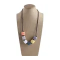 Teething necklace with colorful silicone octagon beads in pastel shades on a black cord - Gray